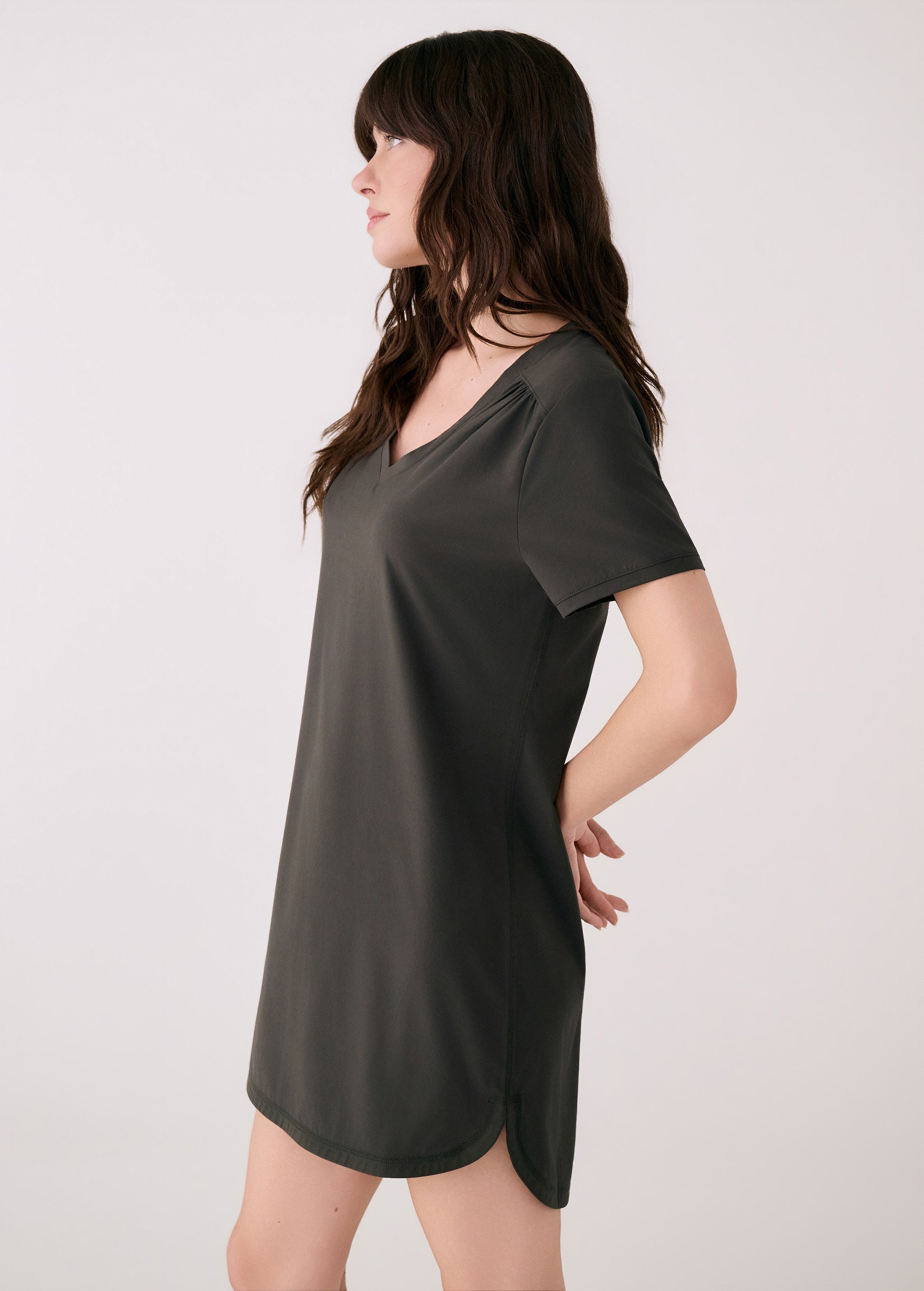 Lolë Olivie V-neck t-shirt dress in olive, side view showing the relaxed shift silhouette