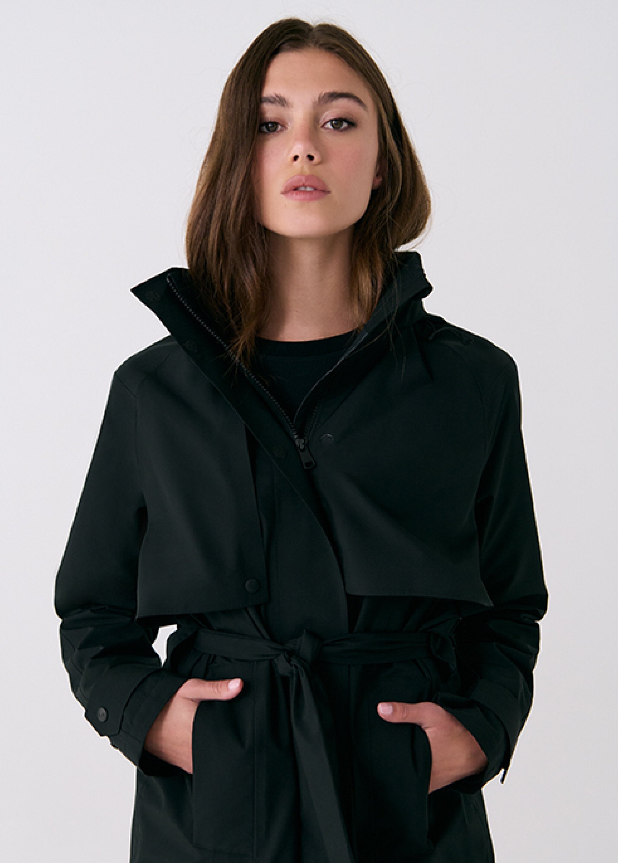 Lolë Alizé Trench Coat in black — fit note: Cut with a relaxed fit for comfortable layering