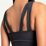 Lolë Step Up Bra in charcoal — this high-support longline sports bra sets you in motion
