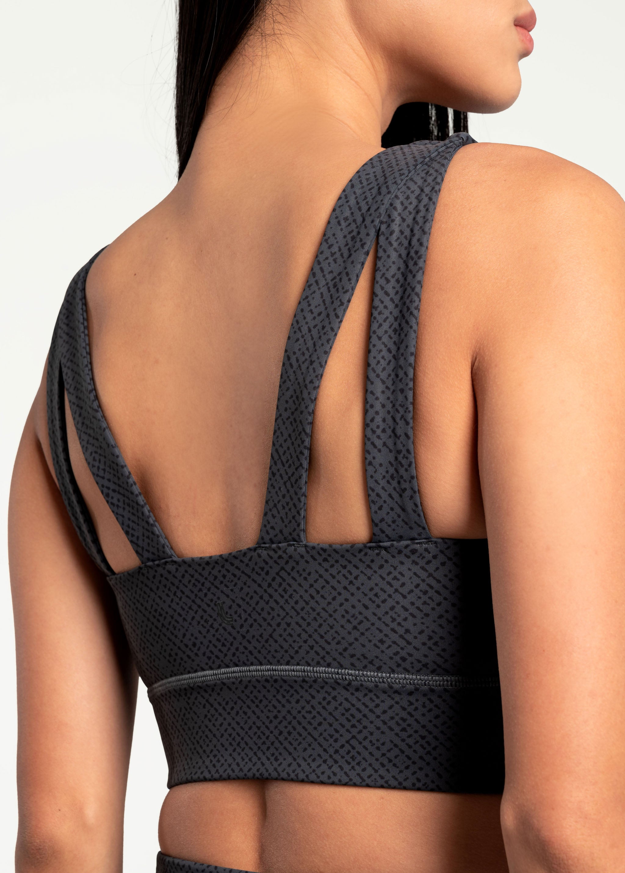 Lolë Step Up Bra in charcoal — this high-support longline sports bra sets you in motion