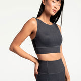 Lolë Step Up Bra in charcoal — this high-support longline sports bra sets you in motion