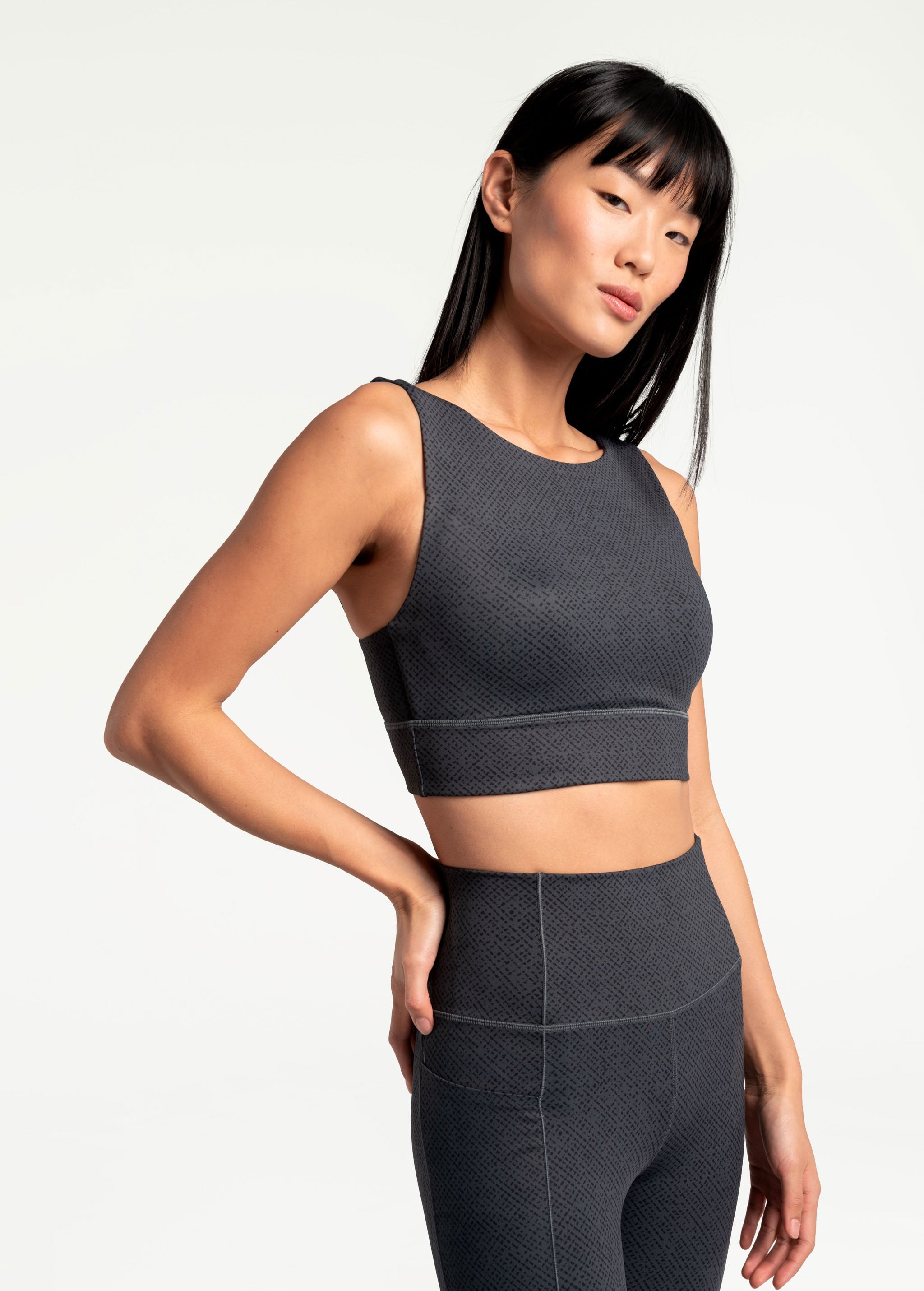 Lolë Step Up Bra in charcoal — this high-support longline sports bra sets you in motion