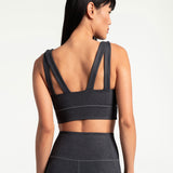 Lolë Step Up Bra in charcoal — this high-support longline sports bra sets you in motion