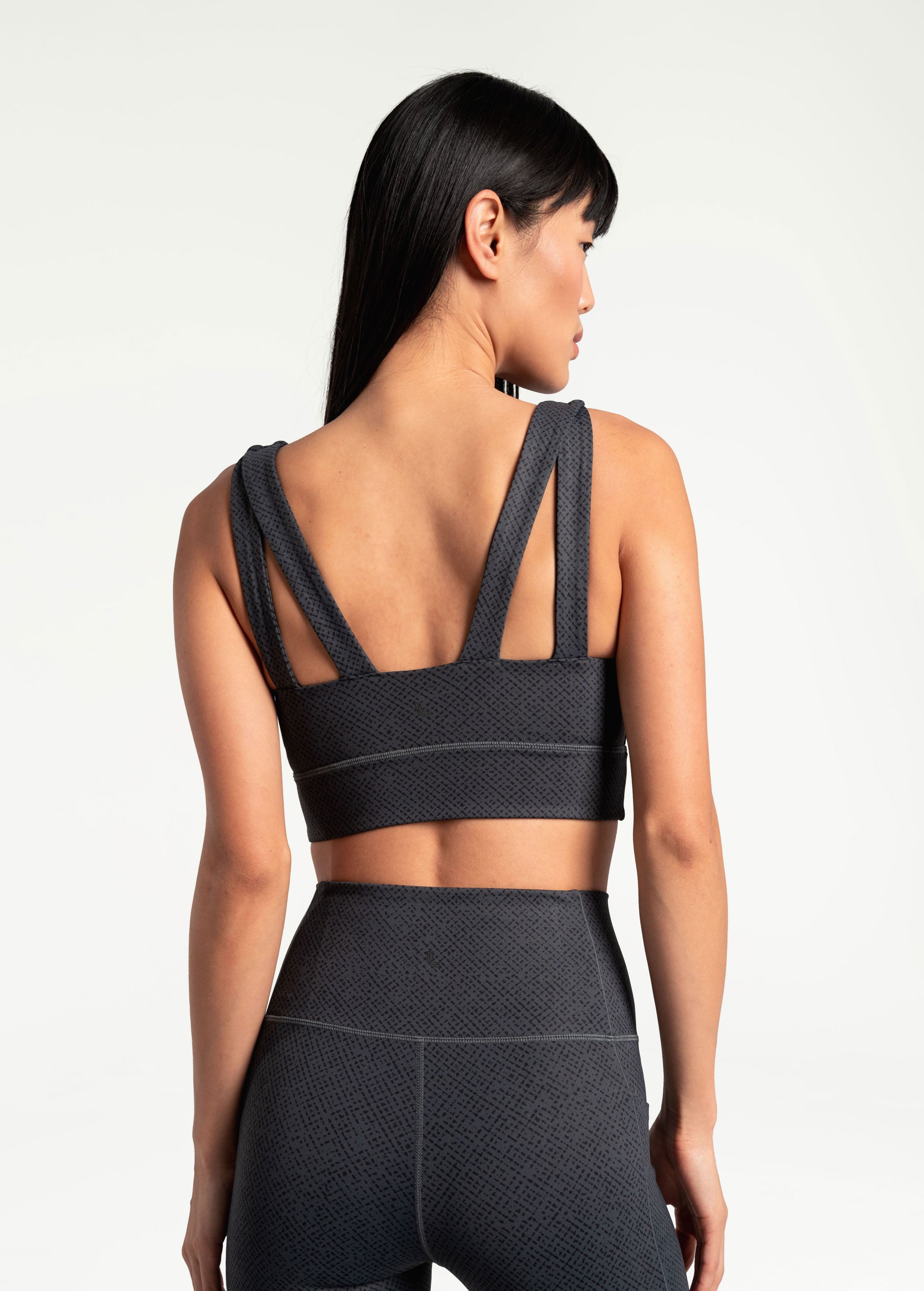 Lolë Step Up Bra in charcoal — this high-support longline sports bra sets you in motion