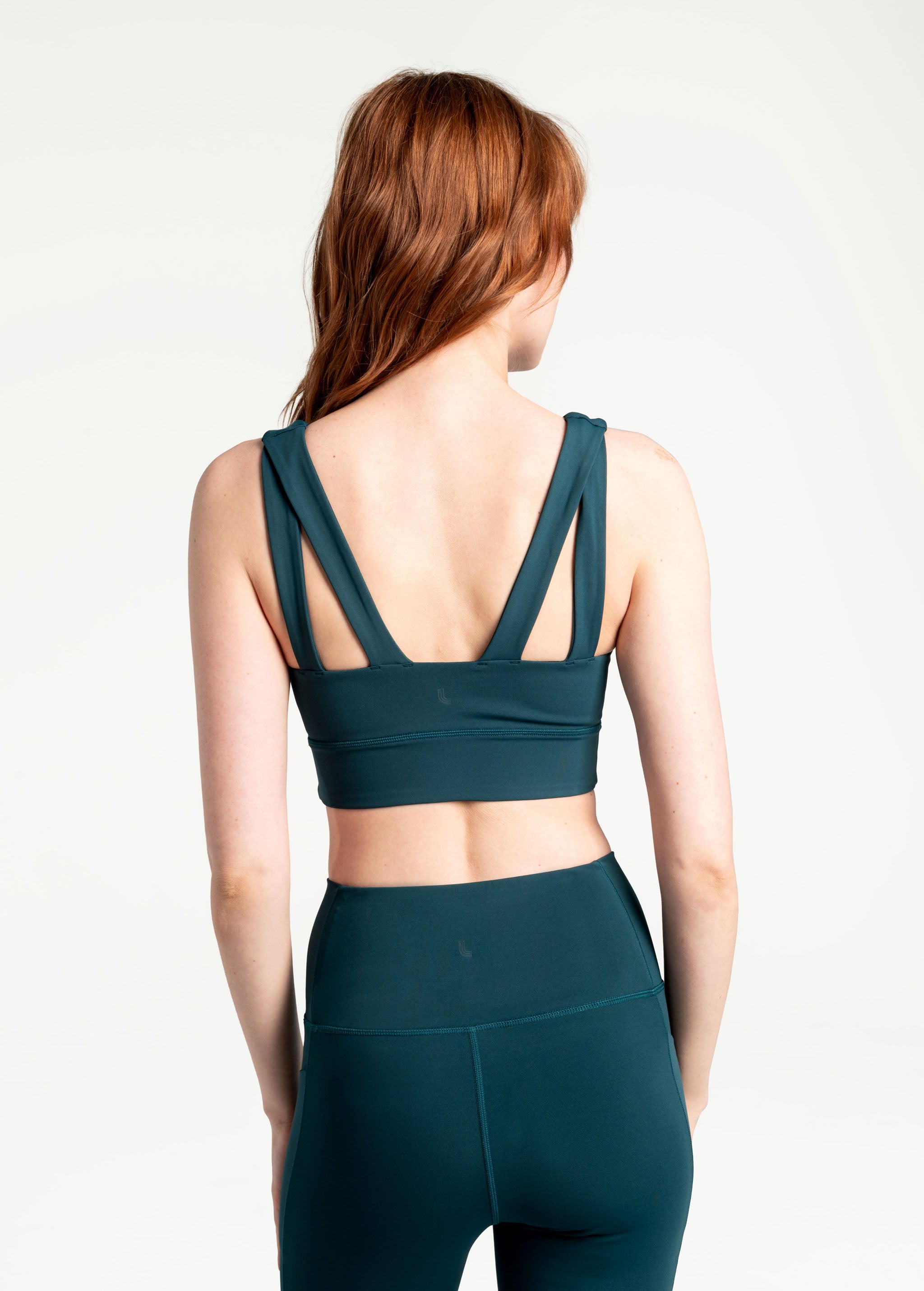 Lolë Step Up Bra in emerald — this high-support longline sports bra sets you in motion
