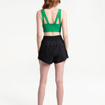 Lolë Step Up Bra in Jade green — this high-support longline sports bra sets you in motion